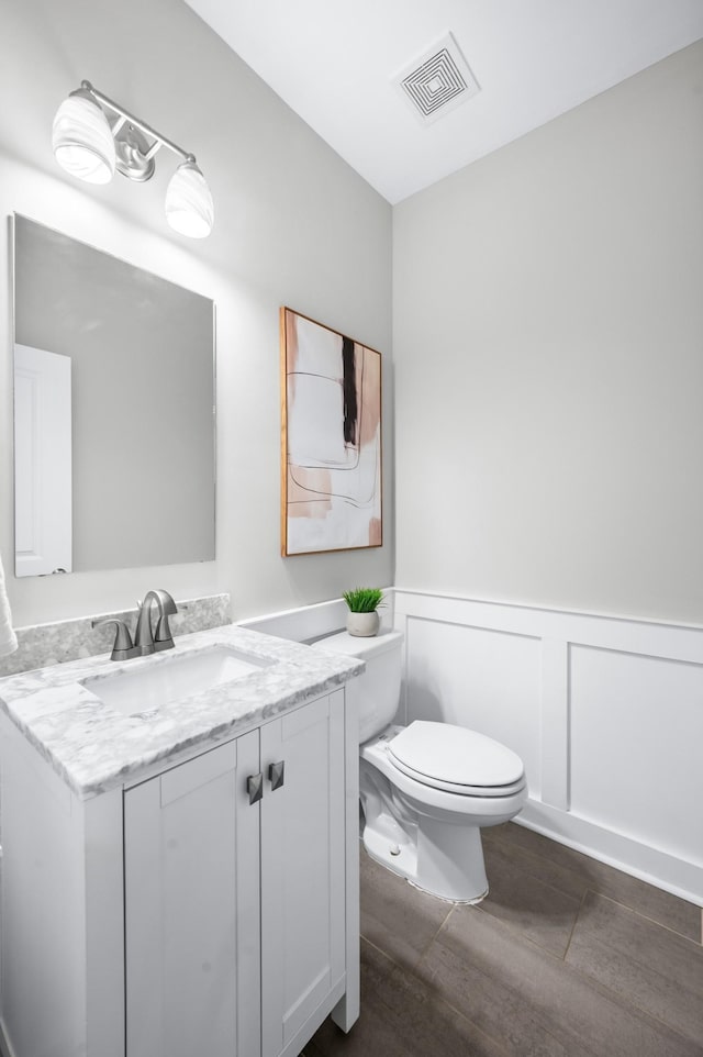 4085 Liberton Way, Nolensville, TN 37135 - bathroom with toilet, wood finished floors, wainscoting, vanity, and a decorative wall