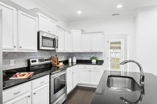 4085 Liberton Way, Nolensville, TN 37135 - kitchen with appliances with stainless steel finishes, a sink, white cabinets, ornamental molding, and recessed lighting