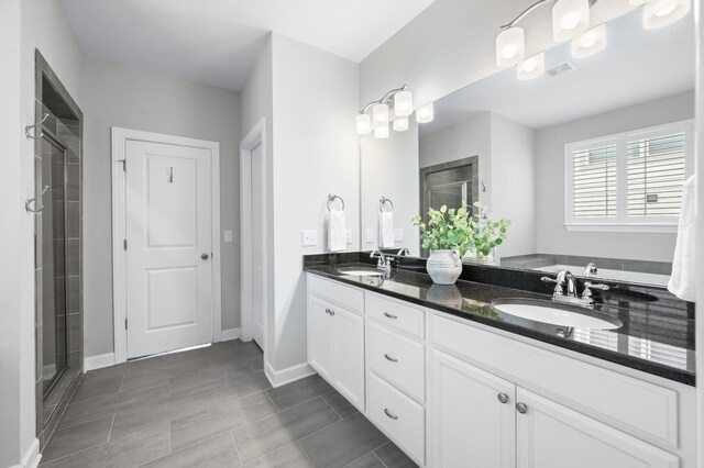 4085 Liberton Way, Nolensville, TN 37135 - bathroom featuring a shower stall, double vanity, and baseboards