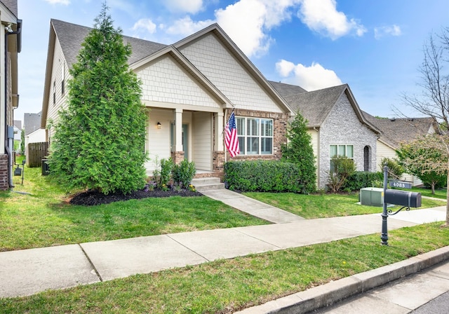 4085 Liberton Way, Nolensville, TN 37135 - view of front of home featuring a front yard, roof with shingles, a porch, and brick siding