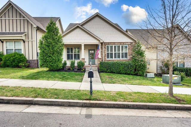 4085 Liberton Way, Nolensville, TN 37135 - view of front of property with board and batten siding, brick siding, and a front lawn