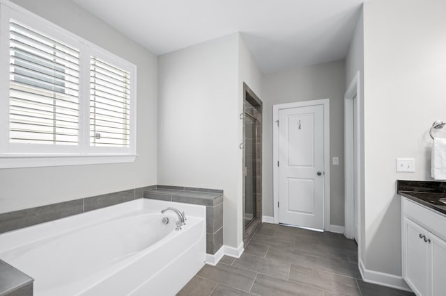4085 Liberton Way, Nolensville, TN 37135 - full bathroom featuring a stall shower, a bath, vanity, and baseboards
