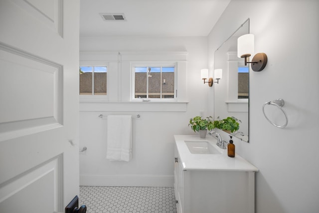 bathroom featuring vanity and baseboards