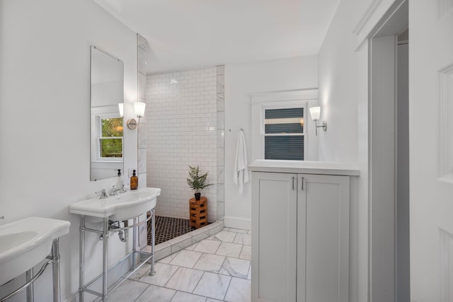 full bathroom featuring a shower stall and marble look tiles