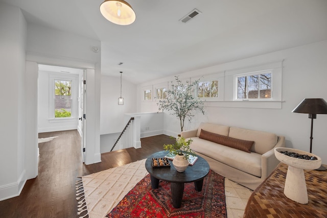 living room with wood finished floors and baseboards