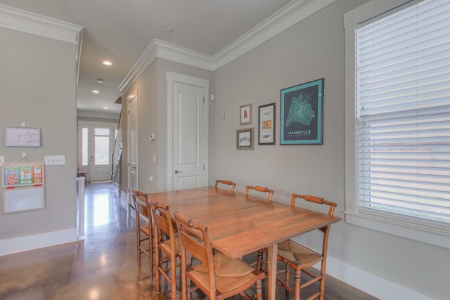 dining room featuring ornamental molding, baseboards, concrete floors, and recessed lighting