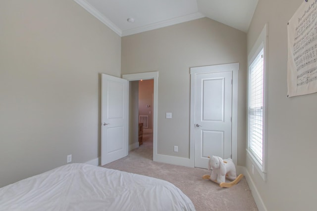 bedroom featuring light carpet, multiple windows, baseboards, lofted ceiling, and ornamental molding