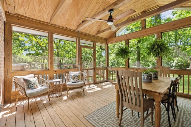 sunroom / solarium with a ceiling fan and outdoor dining space