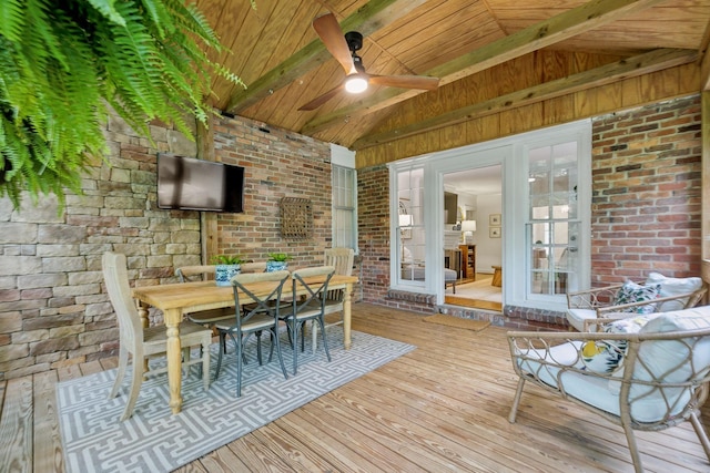 deck with ceiling fan, outdoor dining area, and french doors