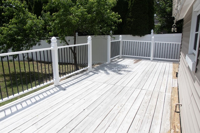 wooden deck featuring fence