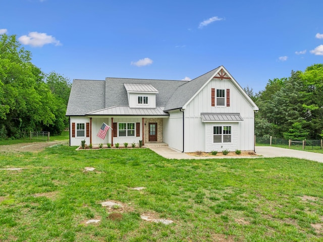 7575 Carthage Hwy, Lebanon, TN 37087 - modern farmhouse with a standing seam roof, board and batten siding, metal roof, a porch, and roof with shingles