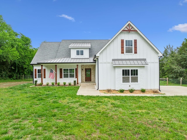 7575 Carthage Hwy, Lebanon, TN 37087 - modern inspired farmhouse featuring a standing seam roof, metal roof, board and batten siding, roof with shingles, and a porch
