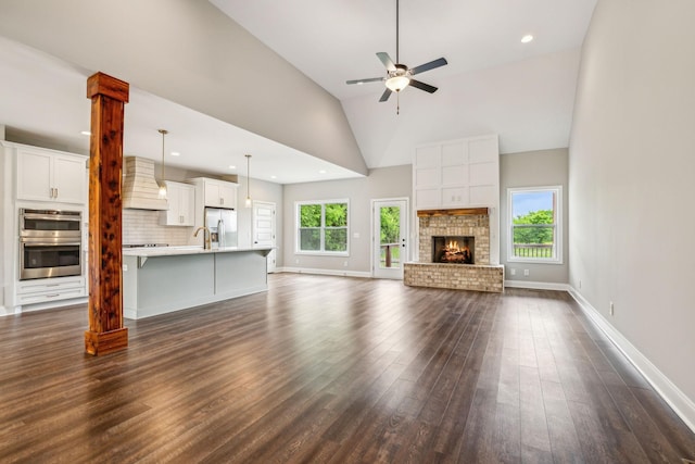 7575 Carthage Hwy, Lebanon, TN 37087 - unfurnished living room with a ceiling fan, dark wood finished floors, baseboards, a brick fireplace, and recessed lighting