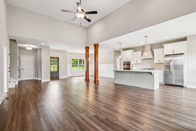 7575 Carthage Hwy, Lebanon, TN 37087 - unfurnished living room featuring dark wood-style floors, a ceiling fan, baseboards, decorative columns, and recessed lighting