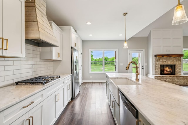 7575 Carthage Hwy, Lebanon, TN 37087 - kitchen featuring custom exhaust hood, appliances with stainless steel finishes, a sink, dark wood-style floors, and tasteful backsplash