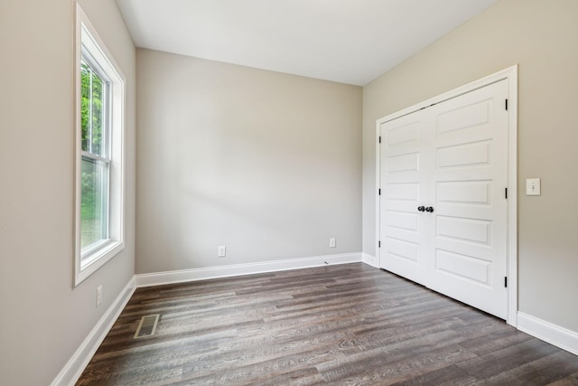 7575 Carthage Hwy, Lebanon, TN 37087 - unfurnished bedroom with dark wood-type flooring, baseboards, and a closet