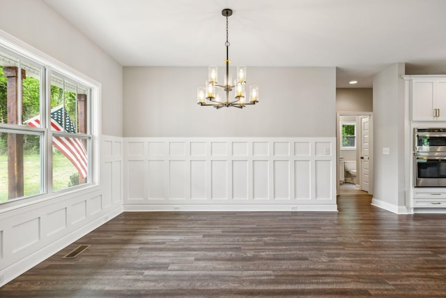 7575 Carthage Hwy, Lebanon, TN 37087 - unfurnished dining area with a chandelier, dark wood-style floors, recessed lighting, and a decorative wall