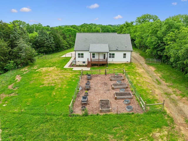 7575 Carthage Hwy, Lebanon, TN 37087 - rear view of house featuring a vegetable garden, a wooden deck, crawl space, and a wooded view