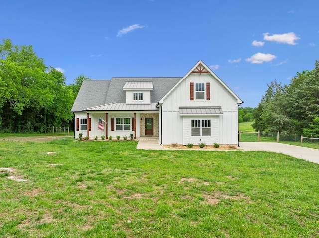 7575 Carthage Hwy, Lebanon, TN 37087 - modern farmhouse with a standing seam roof, board and batten siding, covered porch, metal roof, and driveway