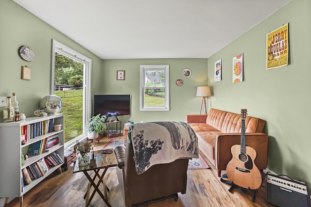 living area with healthy amount of natural light and wood finished floors