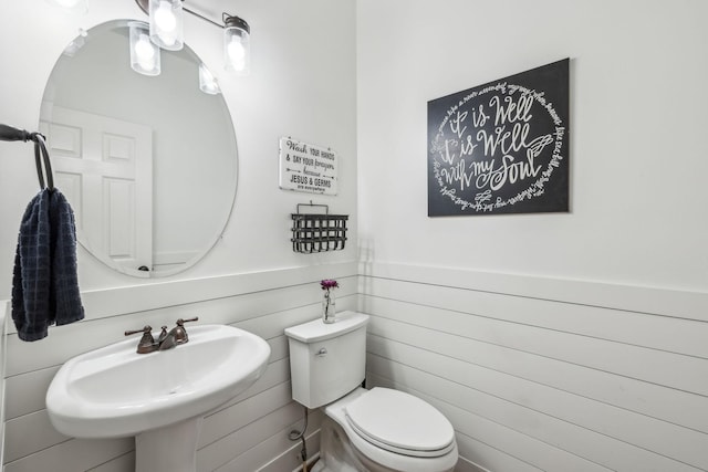 1308 Beech Hollow Dr, Nashville, TN 37211 - half bathroom featuring a sink, toilet, wooden walls, and a wainscoted wall