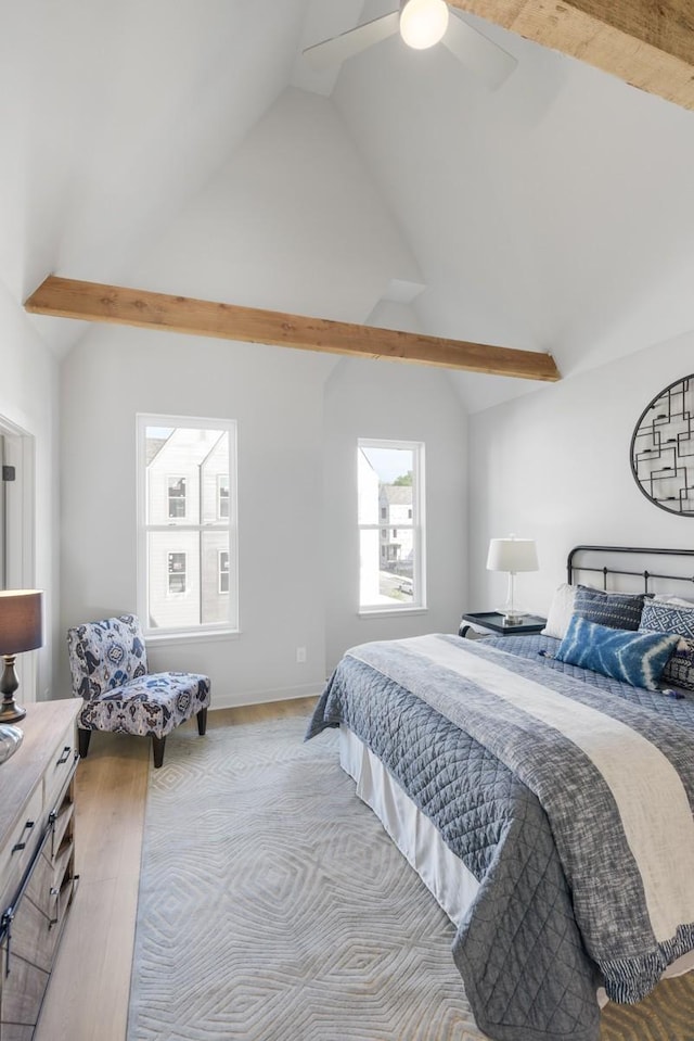 bedroom featuring vaulted ceiling, wood finished floors, and ceiling fan