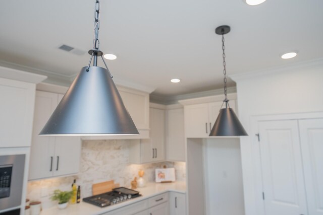 5329 Bridgemore Blvd, Murfreesboro, TN 37129 - kitchen with stainless steel gas cooktop, decorative light fixtures, backsplash, crown molding, and light countertops