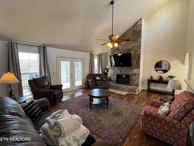 518 Deer Path Ln, Gatlinburg, TN 37738 - living area featuring vaulted ceiling, wood finished floors, a ceiling fan, a fireplace, and french doors