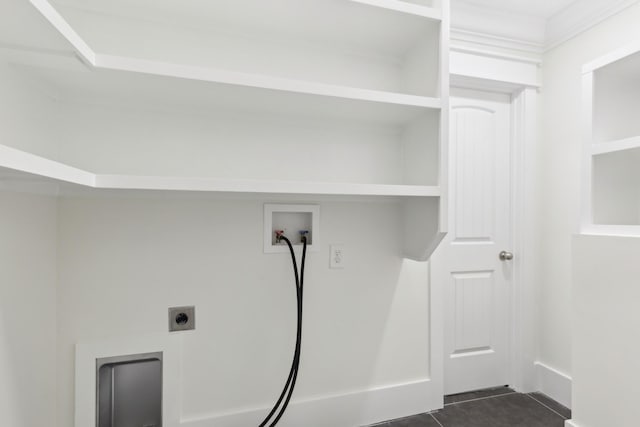washroom featuring washer hookup, dark tile patterned flooring, and electric dryer hookup