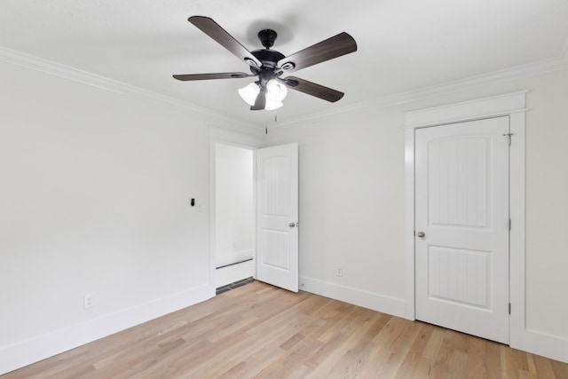 unfurnished bedroom featuring crown molding, light wood-style flooring, baseboards, and ceiling fan