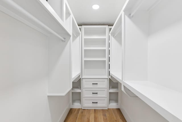 walk in closet featuring light wood-style flooring