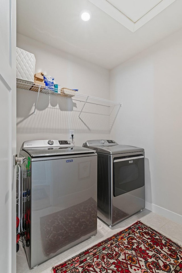 2720 Thornton Grove Blvd, Nashville, TN 37207 - laundry room featuring separate washer and dryer, baseboards, and light tile patterned floors