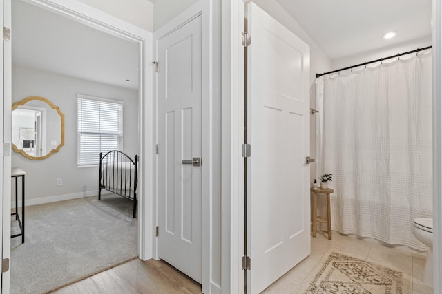 2720 Thornton Grove Blvd, Nashville, TN 37207 - bathroom with toilet, baseboards, and a shower with curtain