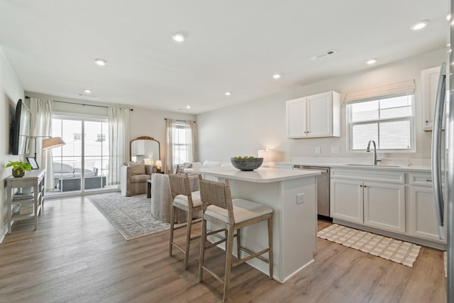 2720 Thornton Grove Blvd, Nashville, TN 37207 - kitchen with a sink, stainless steel appliances, a kitchen island, open floor plan, and light wood-type flooring