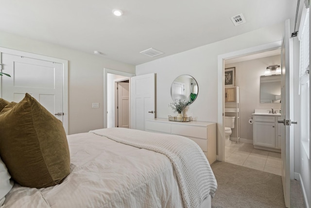 2720 Thornton Grove Blvd, Nashville, TN 37207 - bedroom featuring light carpet, light tile patterned floors, and ensuite bathroom