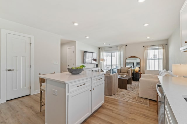 2720 Thornton Grove Blvd, Nashville, TN 37207 - kitchen with healthy amount of natural light, a kitchen bar, white cabinetry, light wood-style flooring, and recessed lighting