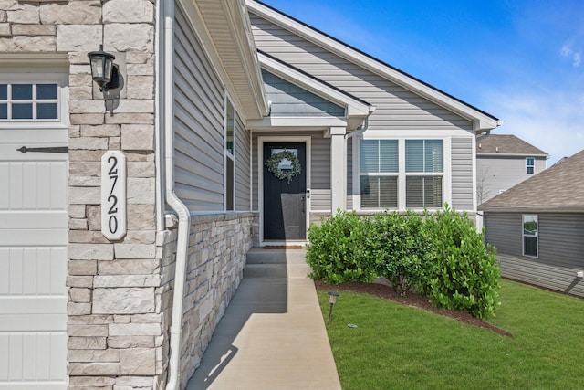 2720 Thornton Grove Blvd, Nashville, TN 37207 - doorway to property featuring a lawn and stone siding