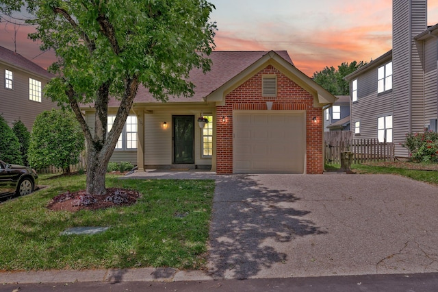view of front of property with a garage, asphalt driveway, brick siding, and a shingled roof