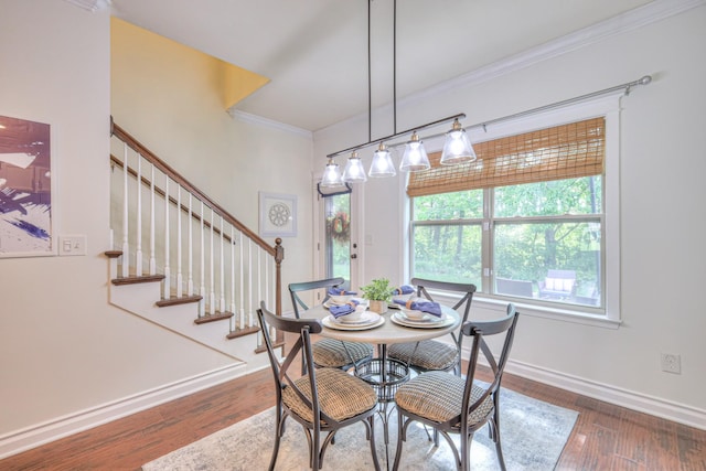 1008 Beverly Ln, Spring Hill, TN 37174 - dining room featuring crown molding, baseboards, wood finished floors, and stairway