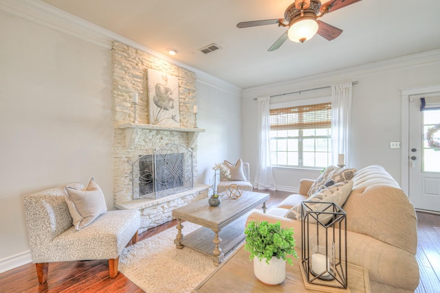 1008 Beverly Ln, Spring Hill, TN 37174 - living area with ornamental molding, wood-type flooring, healthy amount of natural light, a ceiling fan, and a fireplace