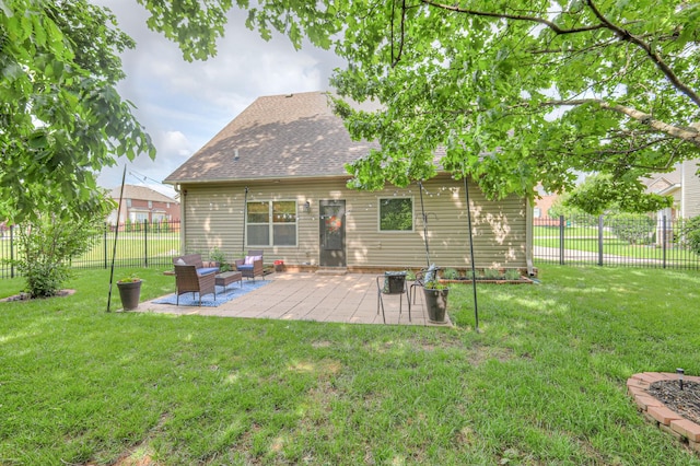 1008 Beverly Ln, Spring Hill, TN 37174 - back of house with a shingled roof, a patio, and an outdoor living space