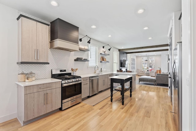 6003B Pennsylvania Ave, Nashville, TN 37209 - kitchen with stainless steel appliances, open floor plan, light countertops, tasteful backsplash, and recessed lighting