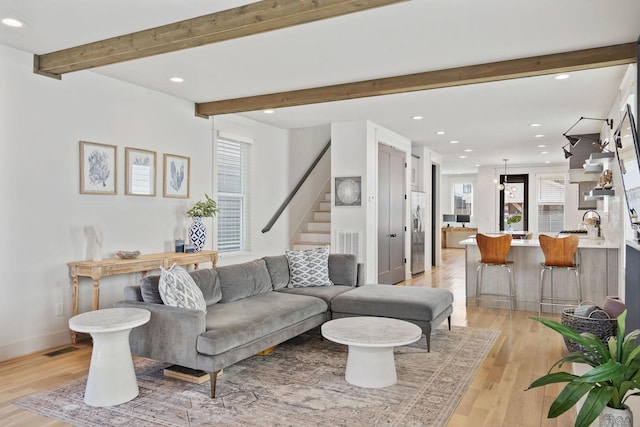 6003B Pennsylvania Ave, Nashville, TN 37209 - living room featuring recessed lighting, beamed ceiling, light wood-type flooring, stairway, and baseboards