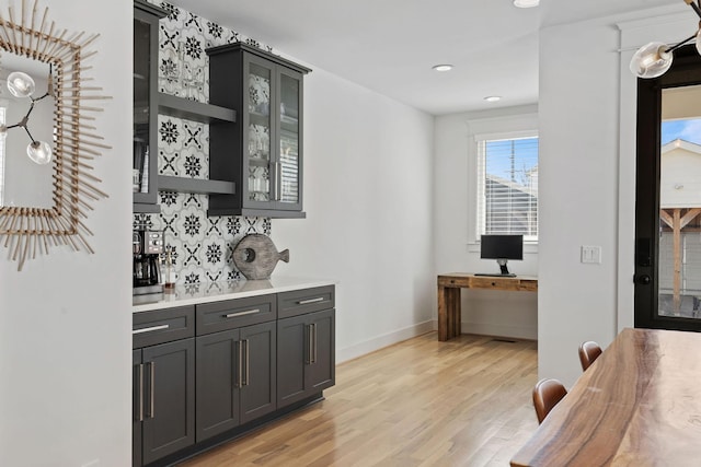 6003B Pennsylvania Ave, Nashville, TN 37209 - bar area featuring light wood-style floors, backsplash, baseboards, and recessed lighting