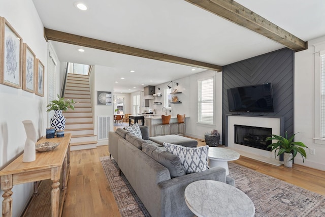 6003B Pennsylvania Ave, Nashville, TN 37209 - living area featuring beam ceiling, stairway, light wood-style flooring, a large fireplace, and recessed lighting