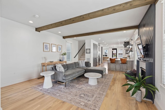 6003B Pennsylvania Ave, Nashville, TN 37209 - living area with stairs, light wood-style flooring, a fireplace, beamed ceiling, and baseboards