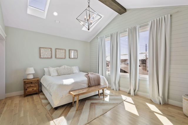 6003B Pennsylvania Ave, Nashville, TN 37209 - bedroom featuring a skylight, light wood-style floors, a chandelier, and baseboards