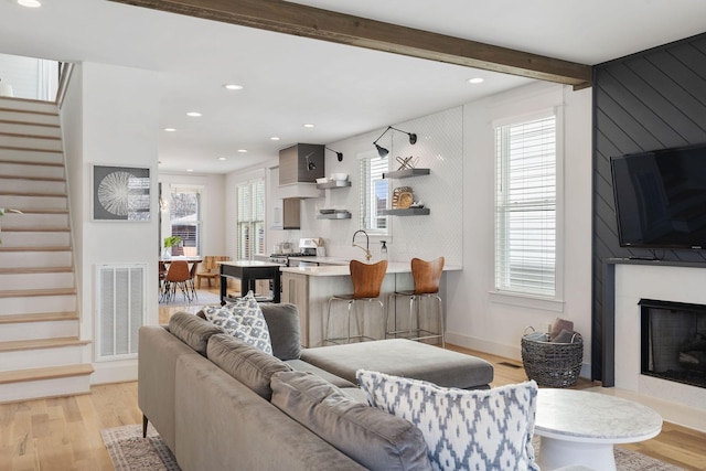 6003B Pennsylvania Ave, Nashville, TN 37209 - living room with stairway, light wood finished floors, recessed lighting, a large fireplace, and beam ceiling