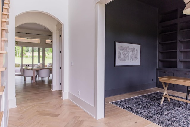 2576 Goose Creek Byp, Franklin, TN 37064 - hallway with arched walkways, baseboards, and built in shelves
