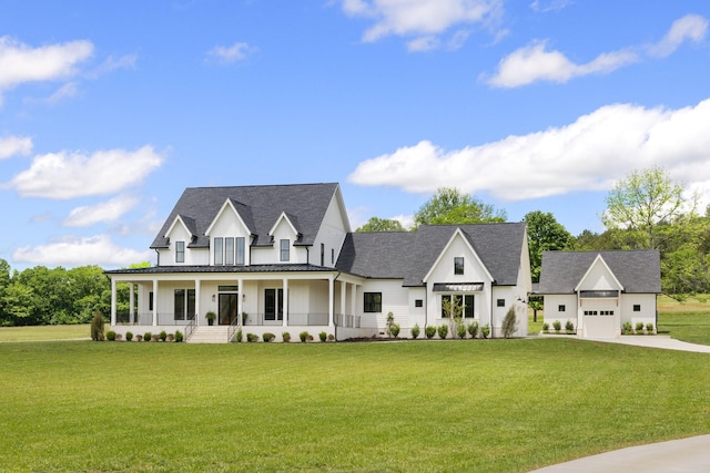2576 Goose Creek Byp, Franklin, TN 37064 - modern farmhouse featuring covered porch, driveway, a front lawn, an attached garage, and a standing seam roof